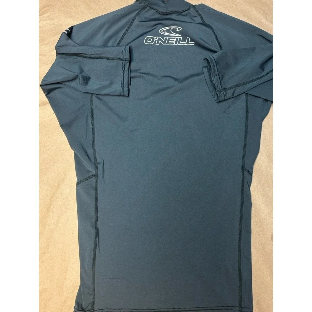 Boys size Medium gray O'Neill rash gaurd with white logo EU.  50+ ultraviolet pr